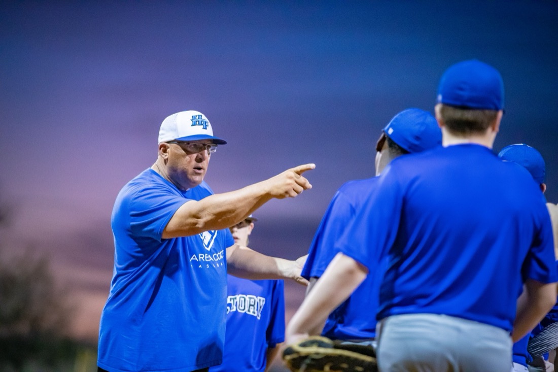 Coach directing players during a Hit Factory baseball session