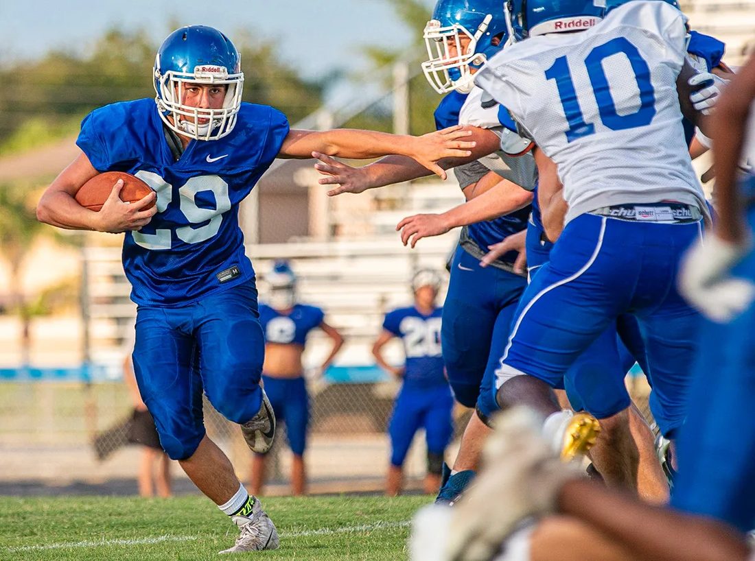 High school football game action — Tampa Bay