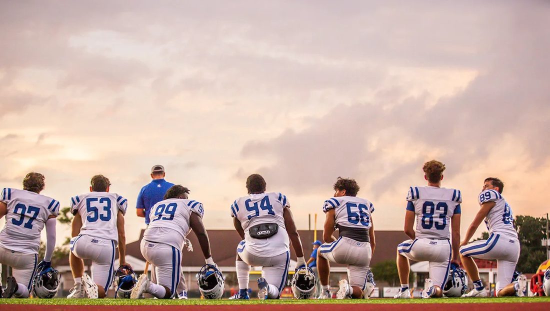 High school football game action — Tampa Bay