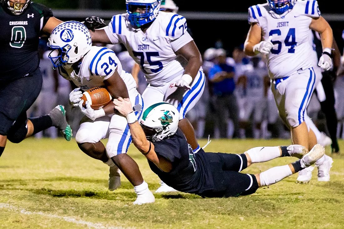 High school football game action — Tampa Bay