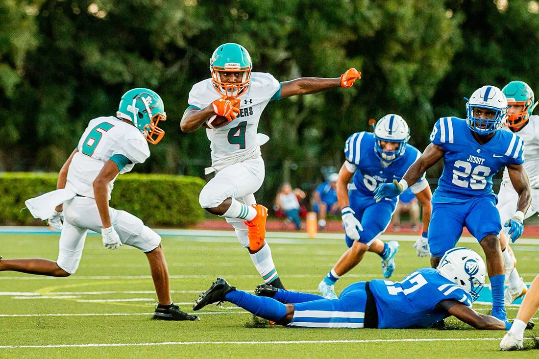 High school football game action — Tampa Bay