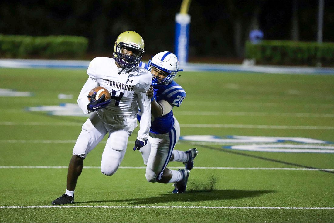 High school football game action — Tampa Bay