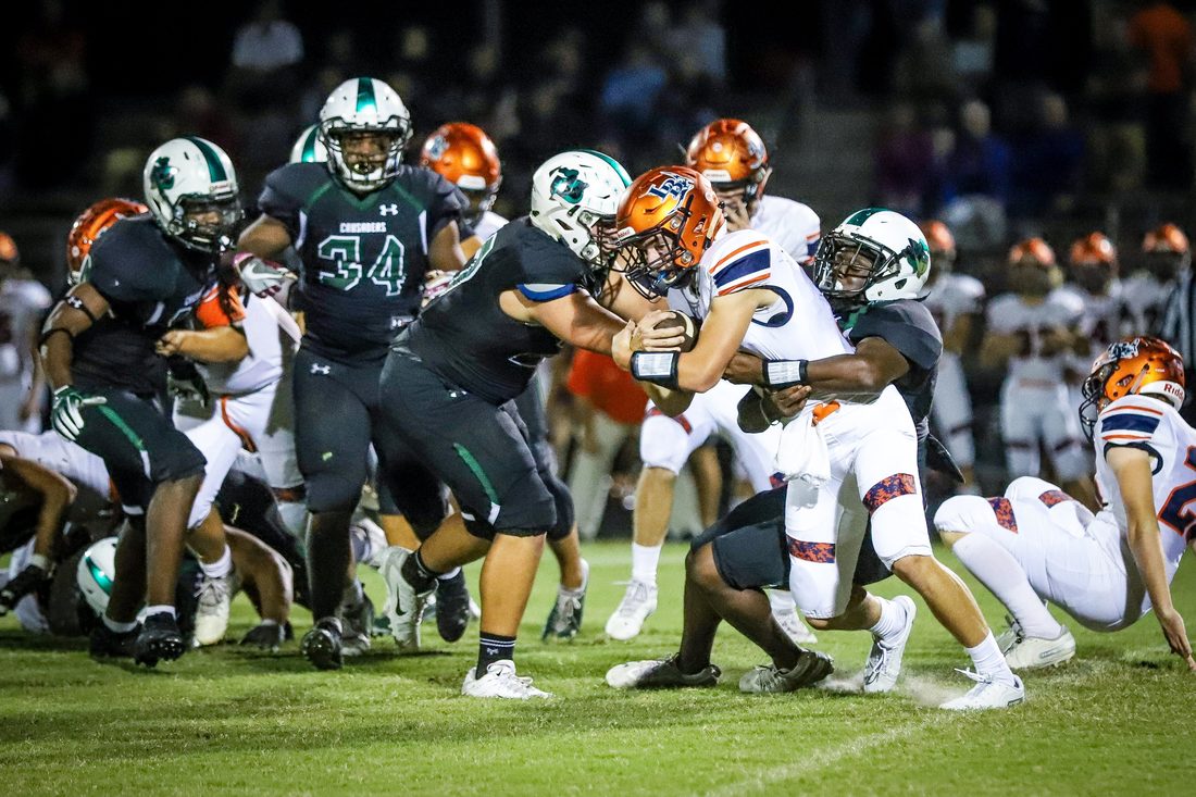 High school football game action — Tampa Bay