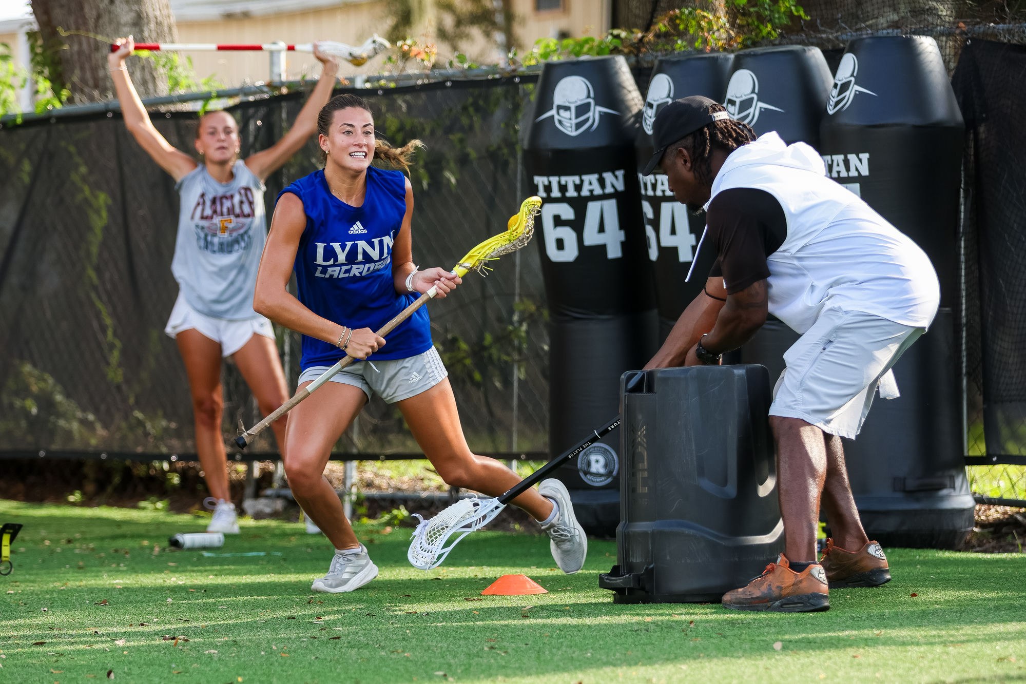 Coach running a lacrosse training drill