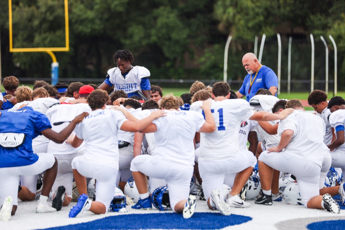 Jesuit football team working through an on-field practice session