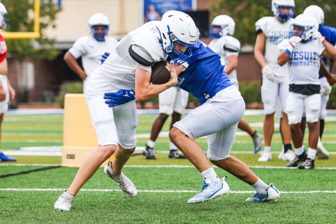 Jesuit football team working through an on-field practice session