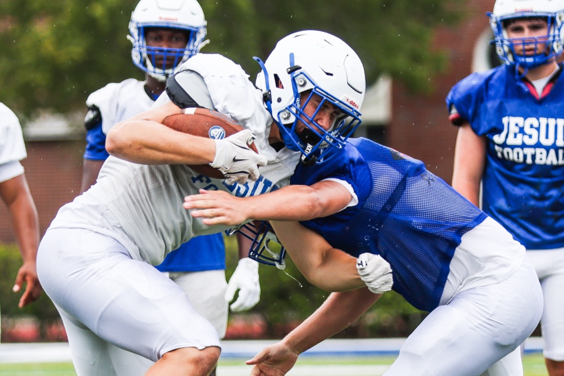Jesuit football team working through an on-field practice session