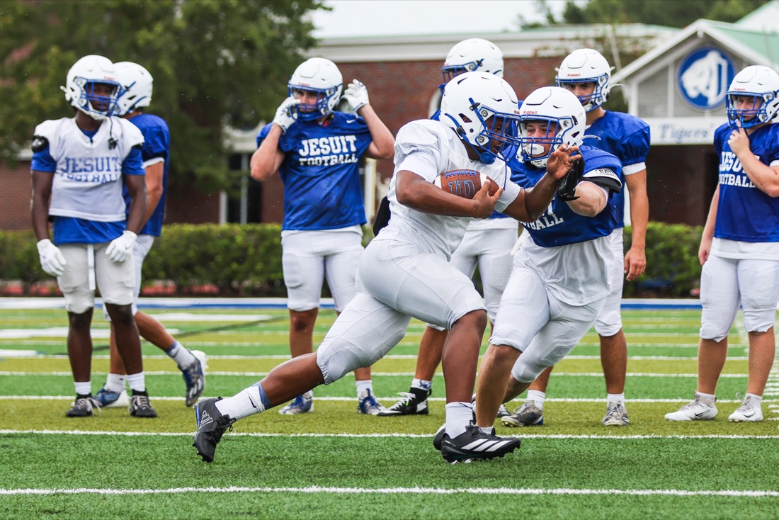 Jesuit football team working through an on-field practice session