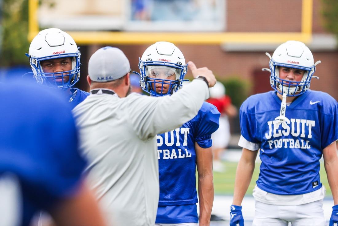 Jesuit football team working through an on-field practice session