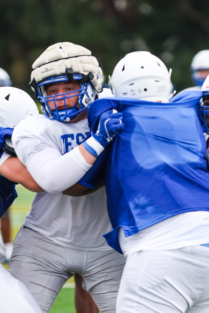 Jesuit football team working through an on-field practice session