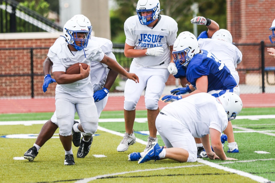 Jesuit football team working through an on-field practice session