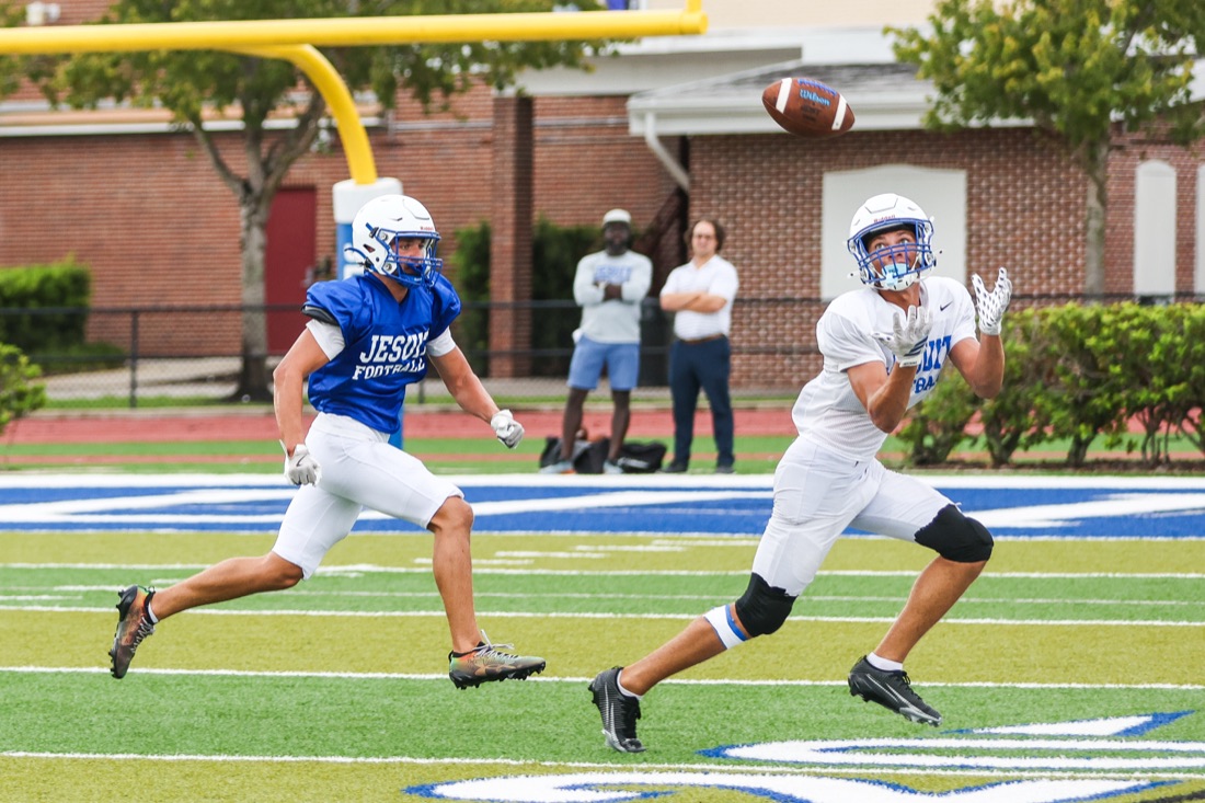 Jesuit football team working through an on-field practice session