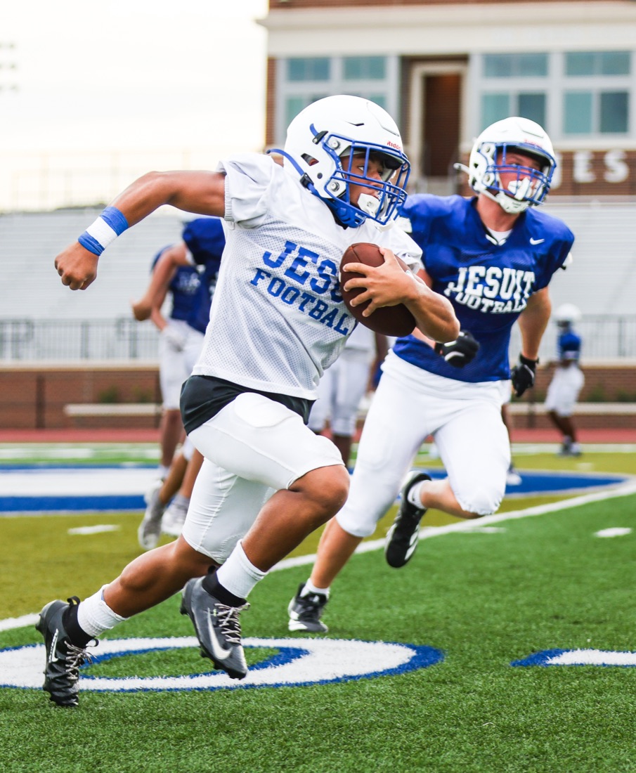 Jesuit football team working through an on-field practice session