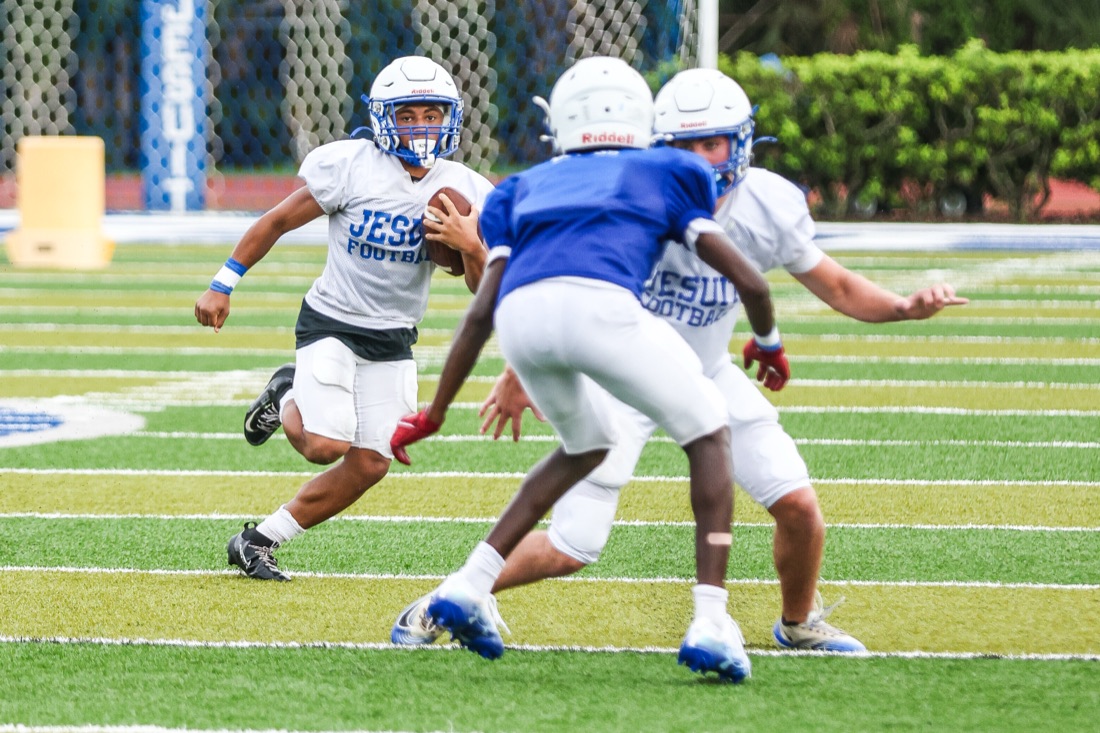 Jesuit football team working through an on-field practice session