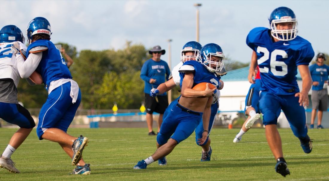High school football practice — drills and live reps
